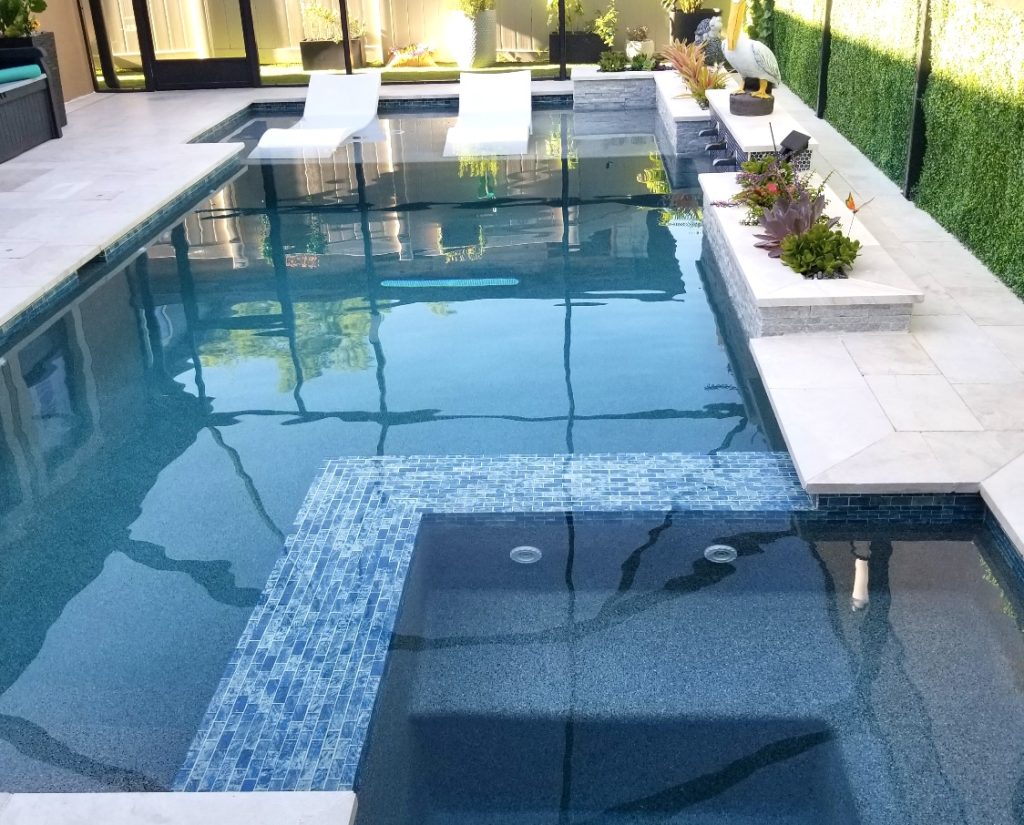 Swimming Pool ledge loungers and tiled spa Carrollwood
