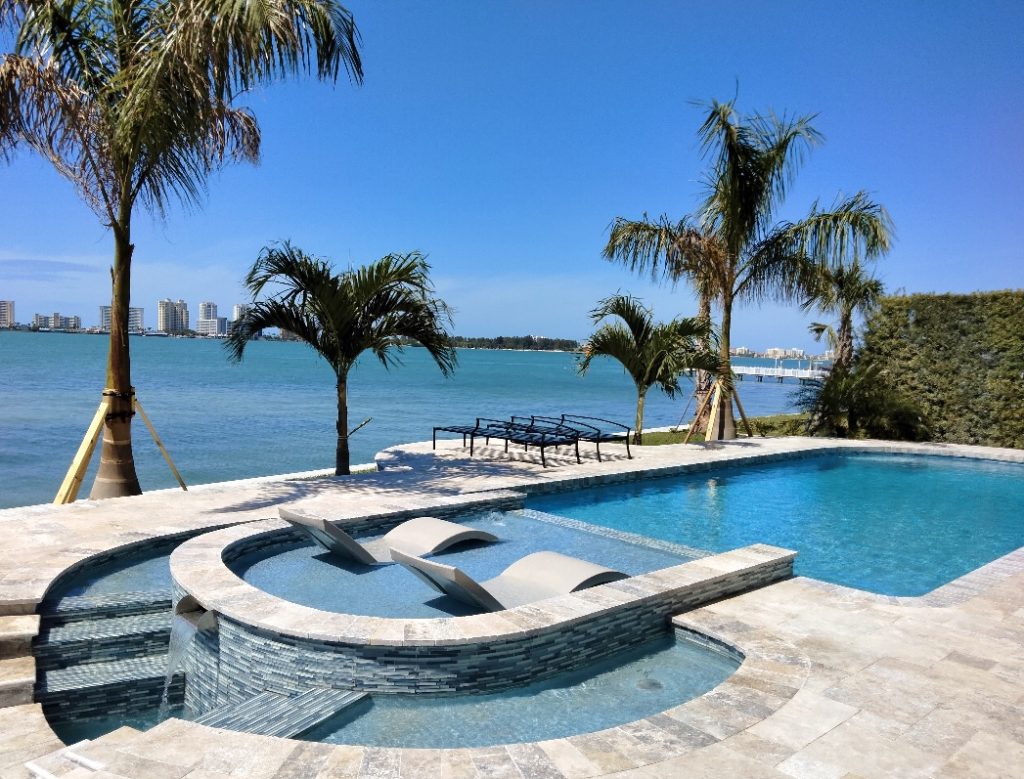 Waterfront Swimming Pool with sunshelf and ledge loungers Belleair Beach
