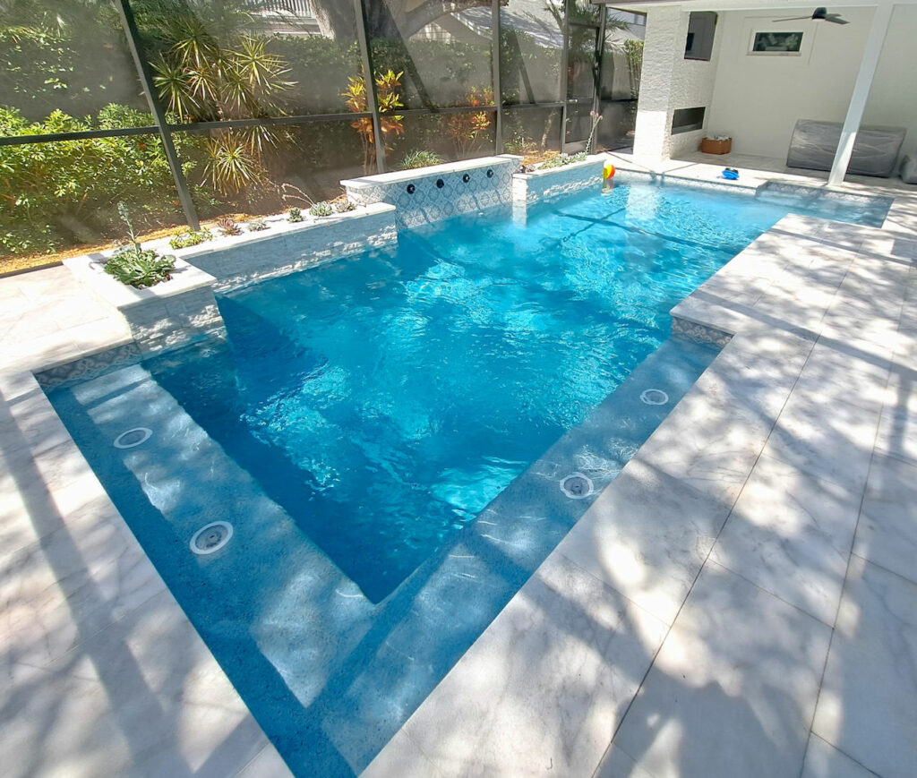 Luxury Geometric Pool with scupper waterfeatures and ledger stone South Tampa