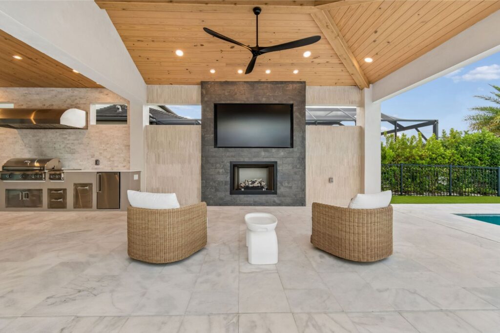 Starkey Ranch Outdoor Kitchen with fireplace and TV